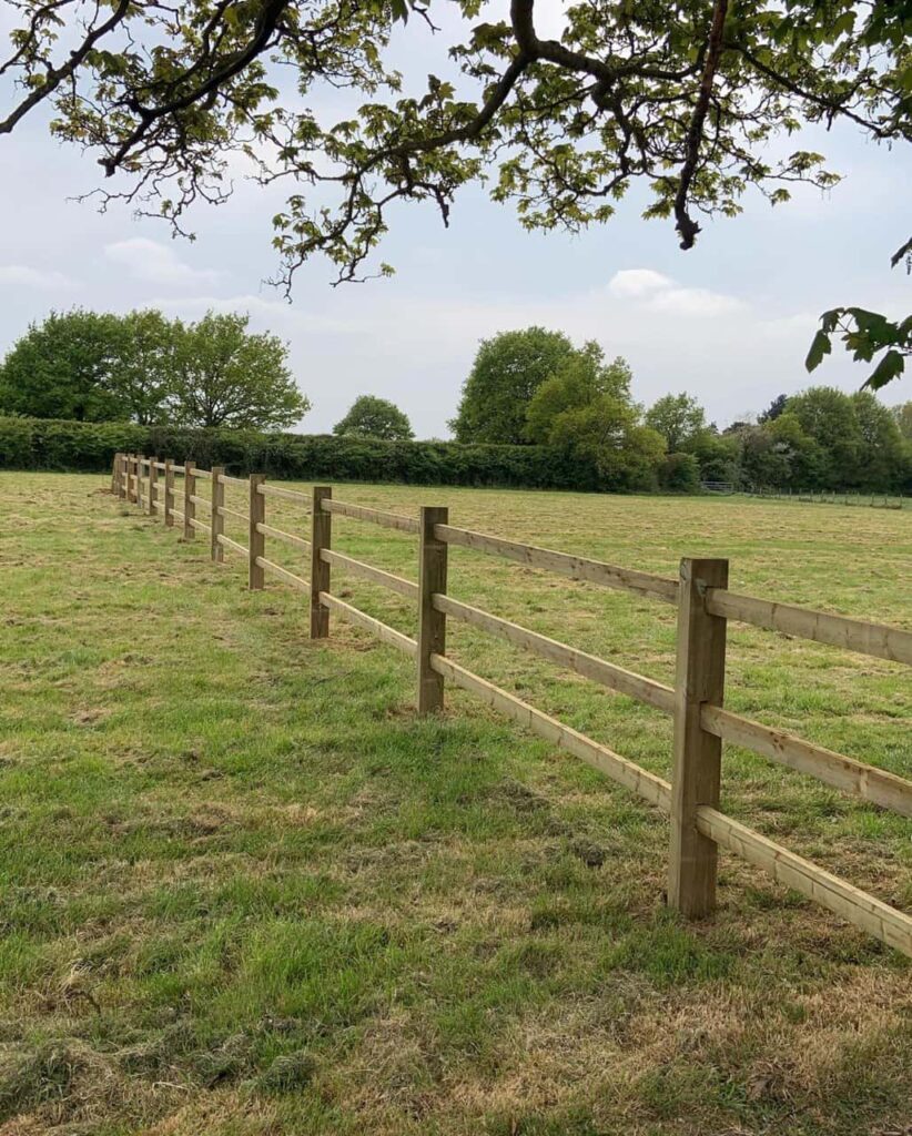This is a photo of a post and rail fence installed in a field by Fast Fix Fencing Bury St Edmunds